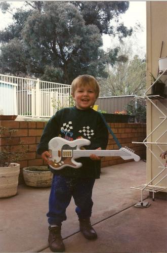 dom playing his quitar